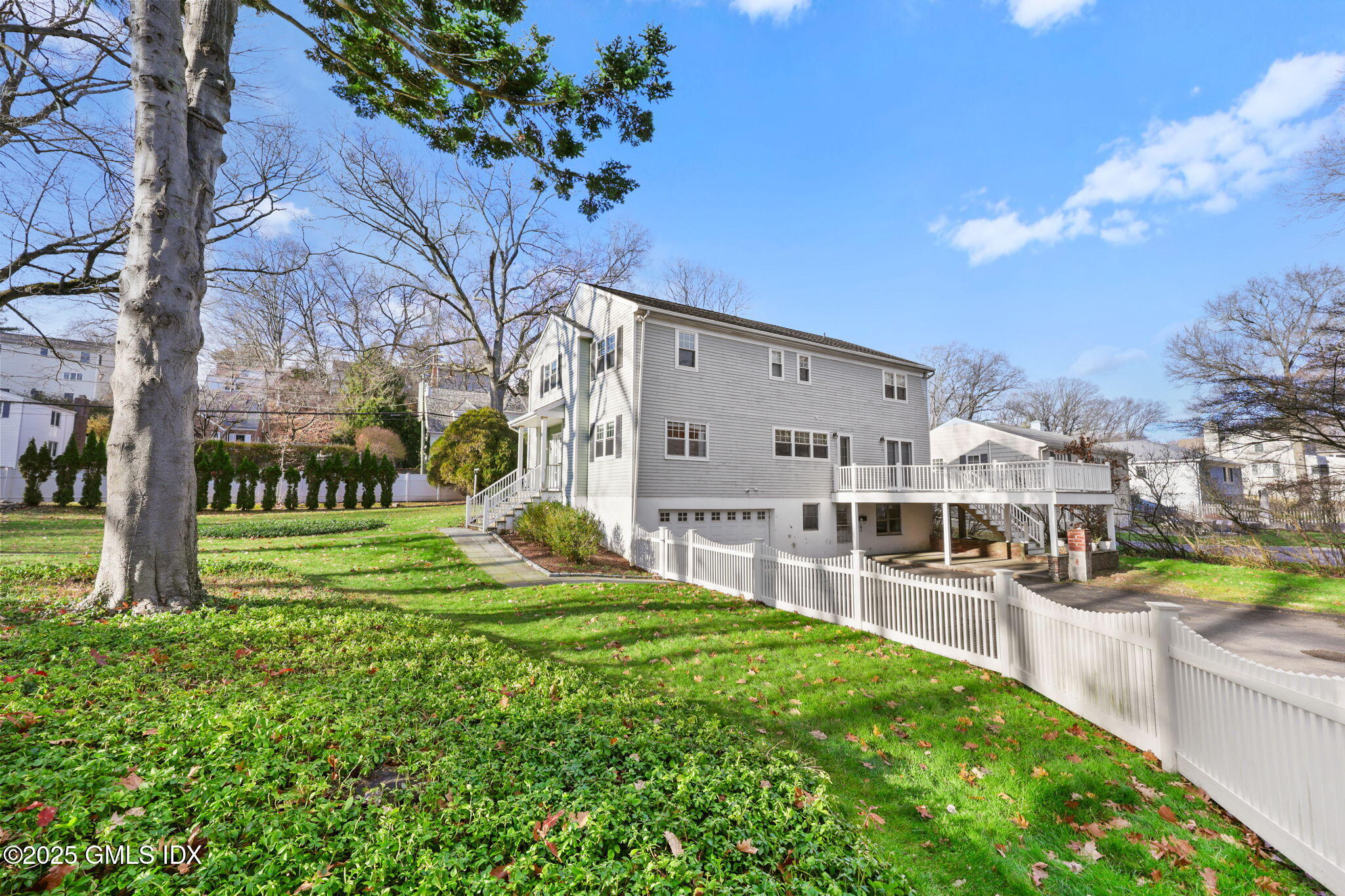 53 Midbrook Lane Old Greenwich, CT 06870 - Photo 36 of 39 a view of a house with a yard