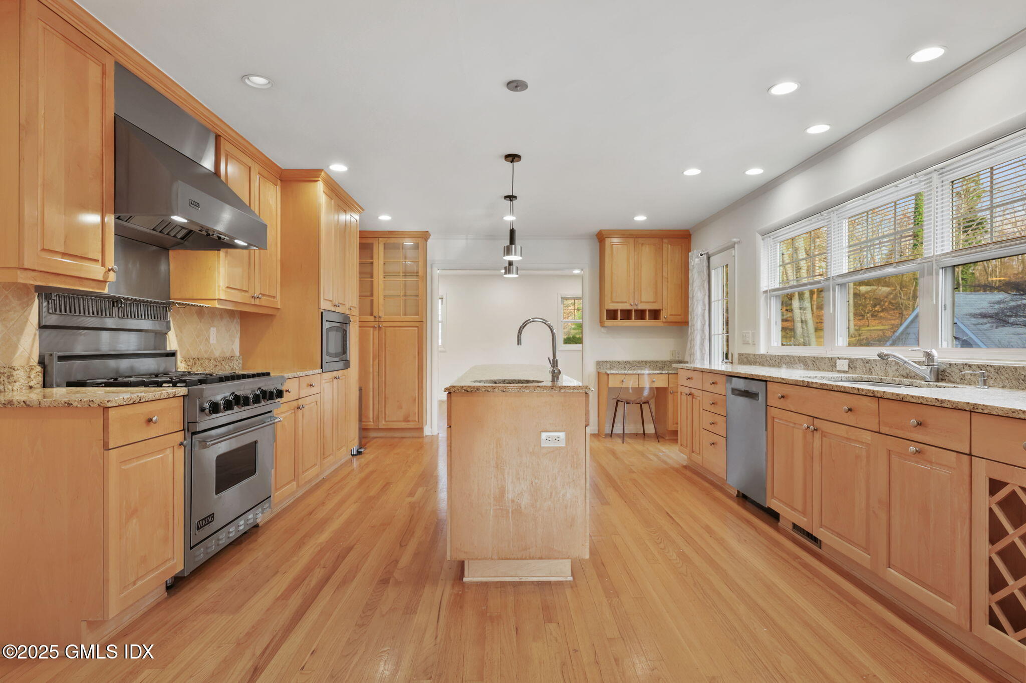 53 Midbrook Lane Old Greenwich, CT 06870 - Photo 8 of 39 a large kitchen with stainless steel appliances granite countertop a stove a sink dishwasher and a refrigerator