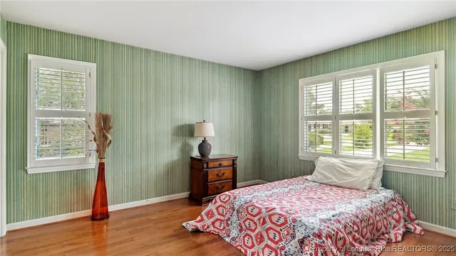 a bathroom with a sink toilet and a mirror