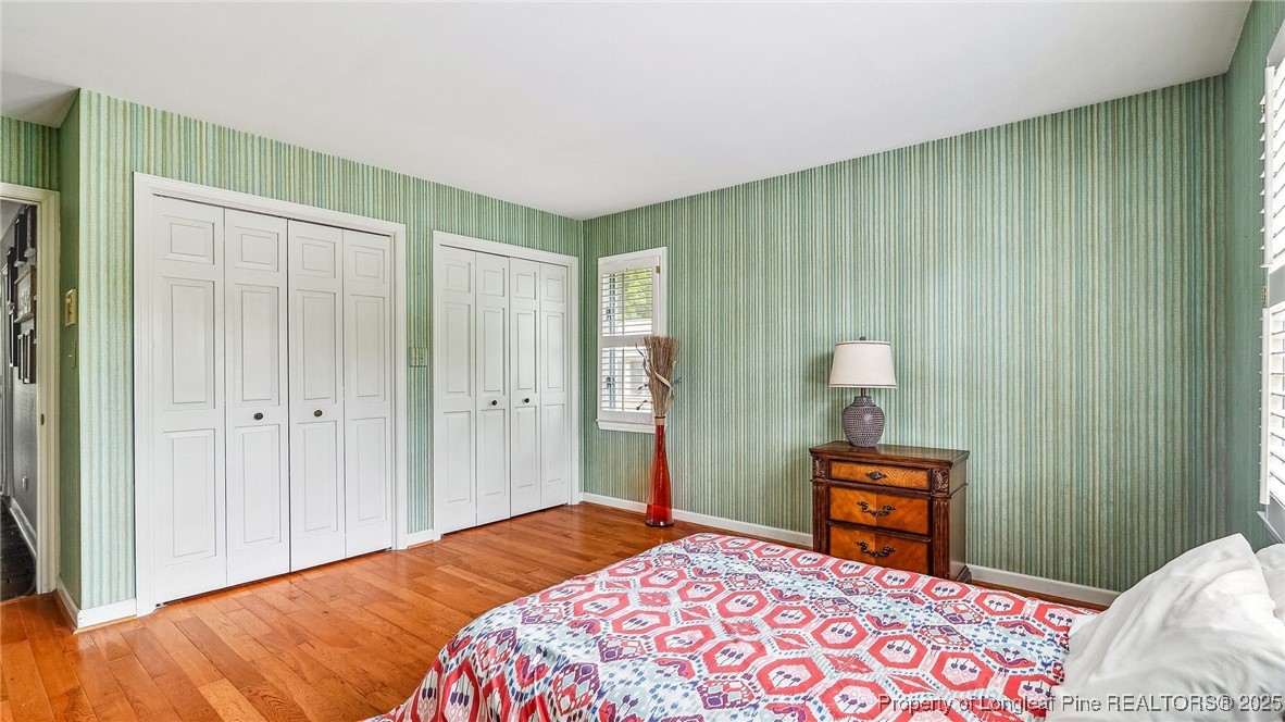 1855 Riverside Boulevard Lumberton, NC 28358 - Photo 28 of 50 a bedroom with a bed and a lamp