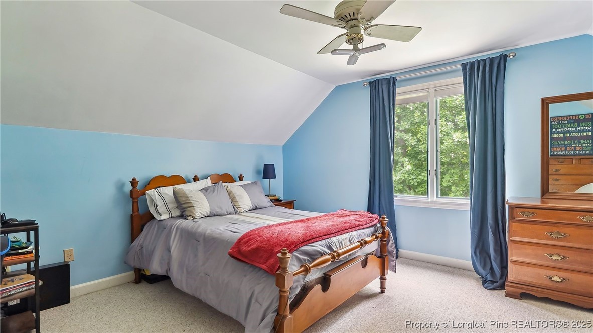 1855 Riverside Boulevard Lumberton, NC 28358 - Photo 34 of 50 a bed sitting in a bedroom next to a window