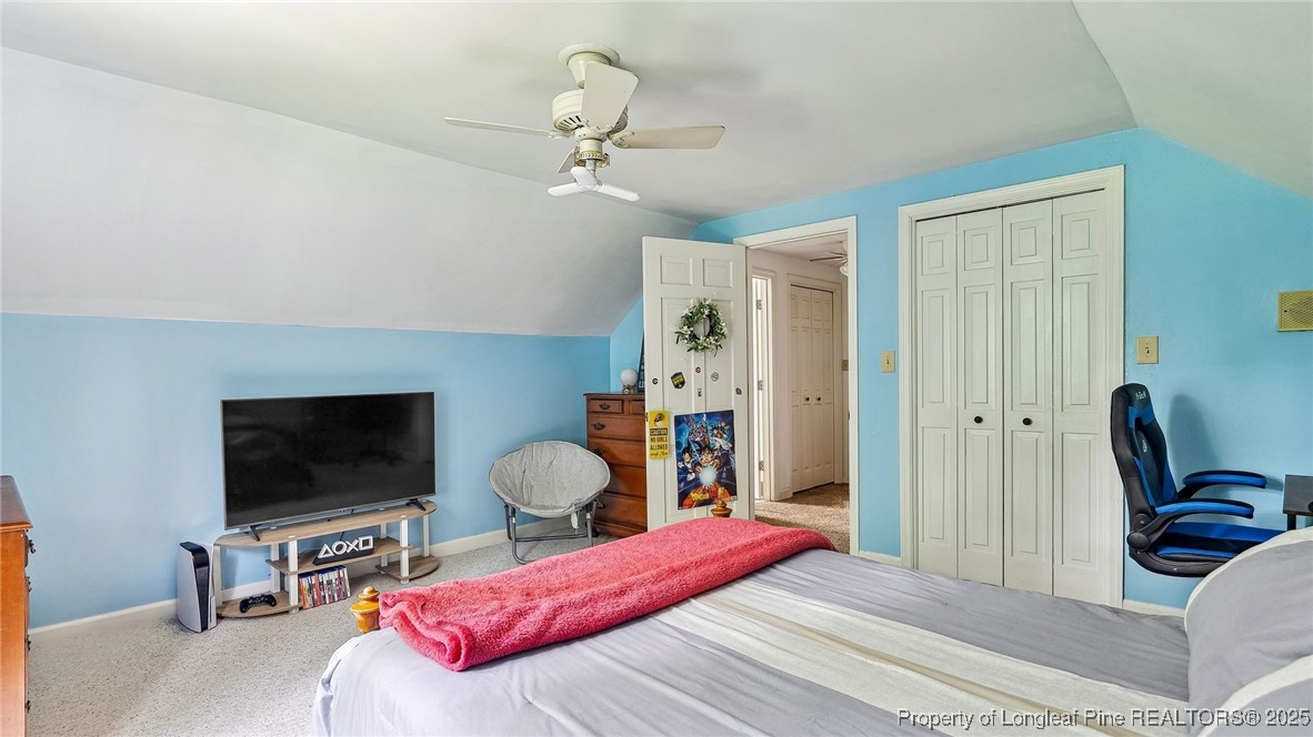 1855 Riverside Boulevard Lumberton, NC 28358 - Photo 35 of 50 a bedroom with a bed and a flat screen tv