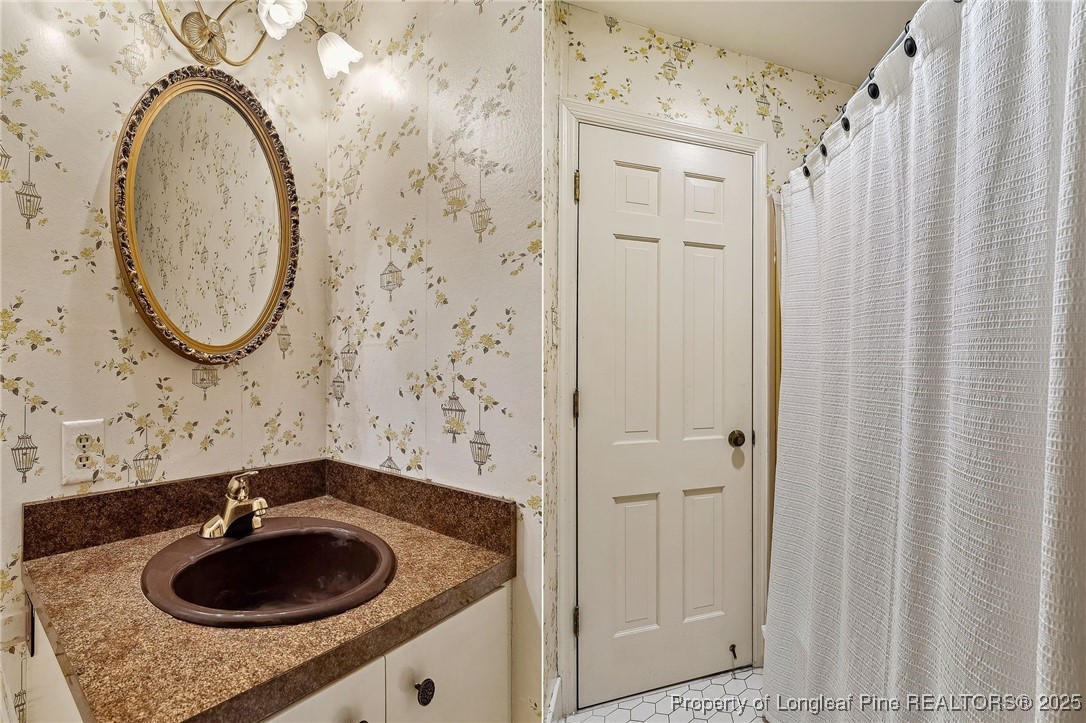 1855 Riverside Boulevard Lumberton, NC 28358 - Photo 36 of 50 a bathroom with a sink a toilet and shower