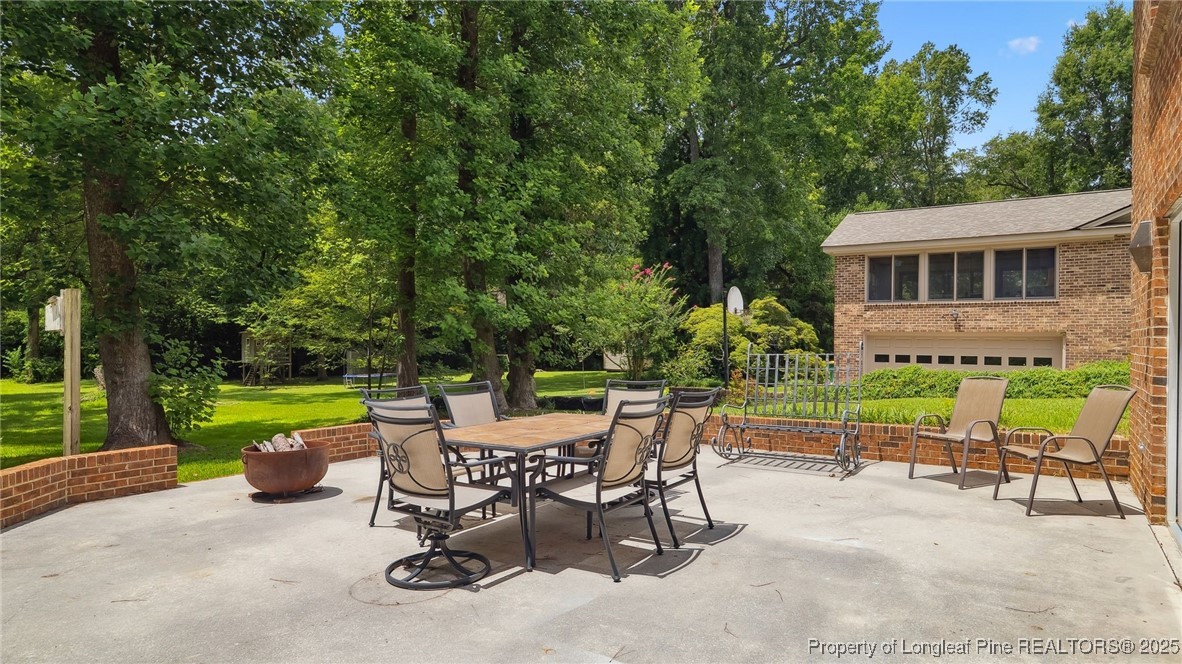 1855 Riverside Boulevard Lumberton, NC 28358 - Photo 41 of 50 a view of a patio with a table and chairs