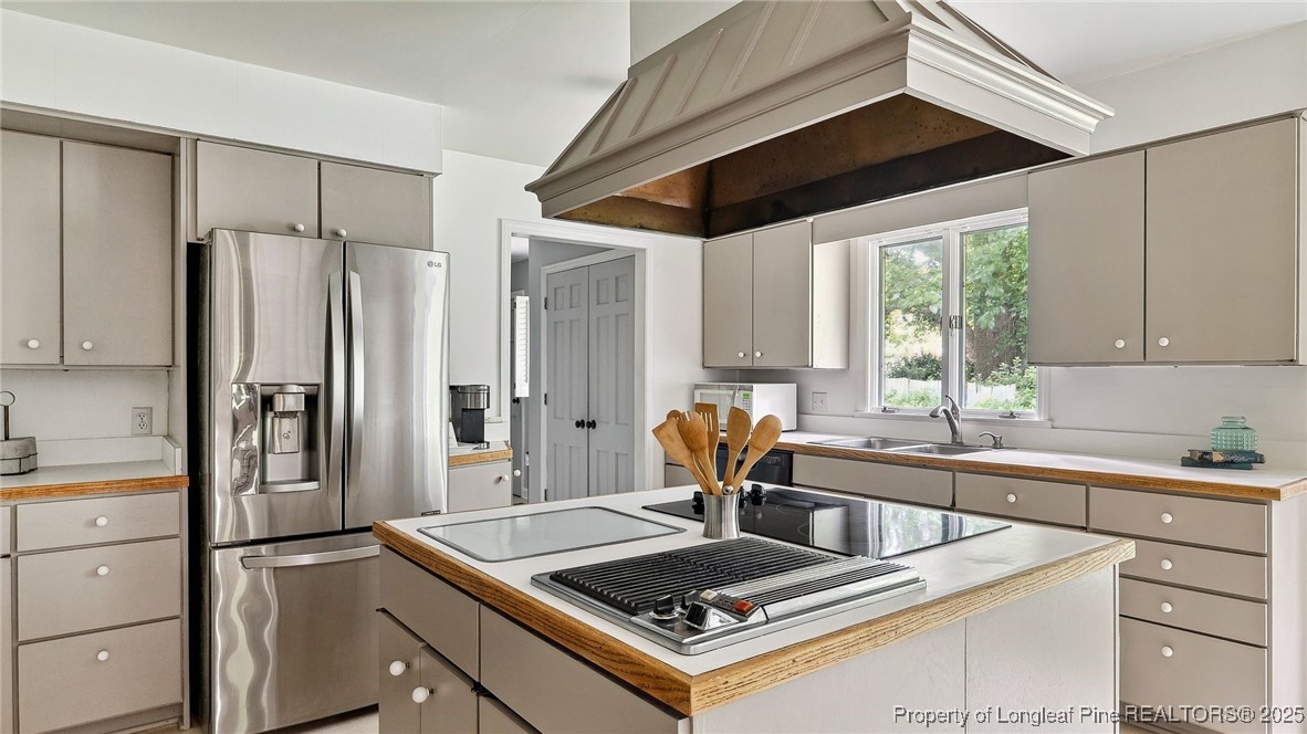 1855 Riverside Boulevard Lumberton, NC 28358 - Photo 10 of 50 a kitchen with stainless steel appliances granite countertop a sink stove and refrigerator