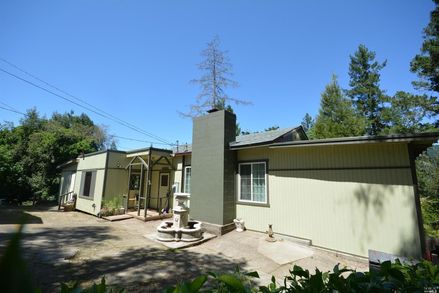 9620 Rio Vista Road Forestville, CA 95436 - Photo 1 of 1 a view of a house with backyard and sitting area