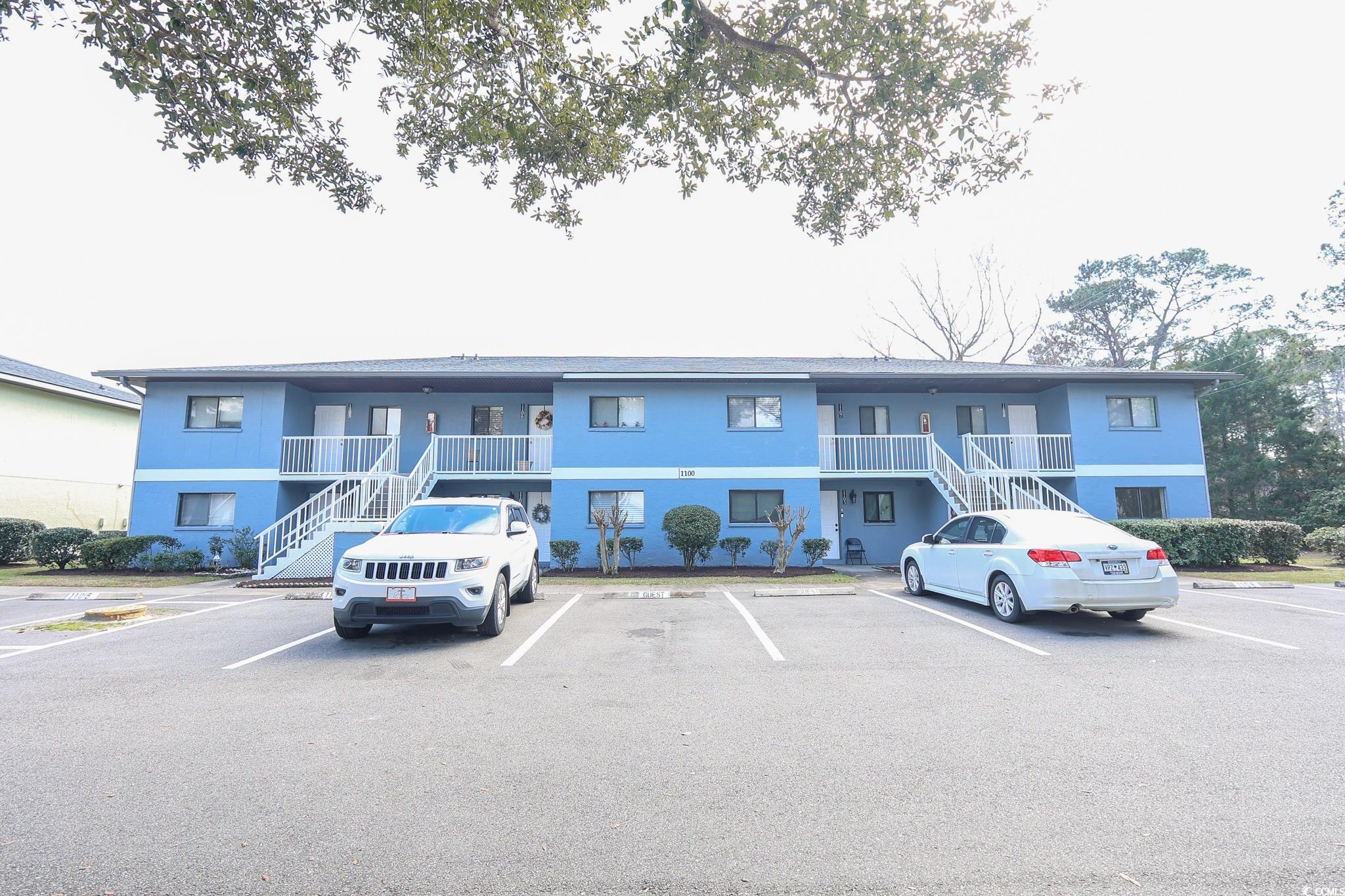 1301 Pridgen Road, Unit 1101 Myrtle Beach, SC 29577 - Photo 1 of 21 View of building exterior with uncovered parking a