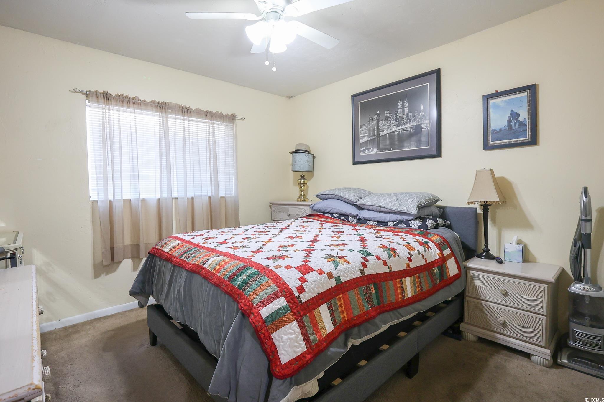 1301 Pridgen Road, Unit 1101 Myrtle Beach, SC 29577 - Photo 12 of 21 Bedroom with ceiling fan, baseboards, and carpet f