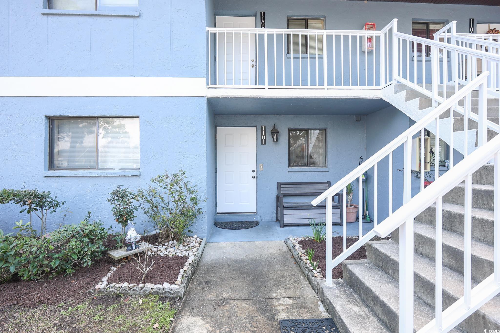 1301 Pridgen Road, Unit 1101 Myrtle Beach, SC 29577 - Photo 20 of 21 View of exterior entry with a balcony and stucco s