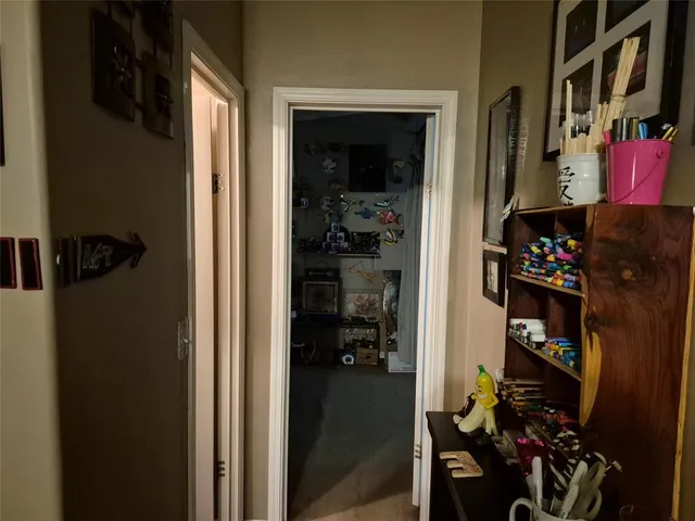 a bathroom with a granite countertop bathtub sink vanity mirror and toilet