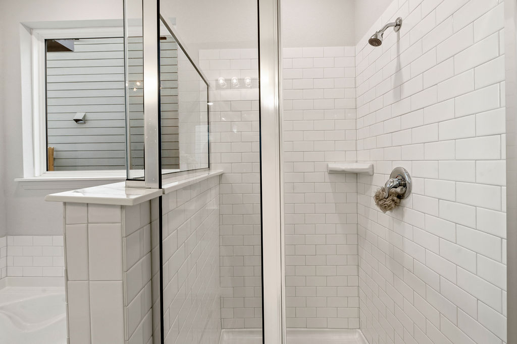 2417 Roosevelt Road Leander, TX 78641 - Photo 18 of 40 Bathroom featuring a stall shower and a garden tub