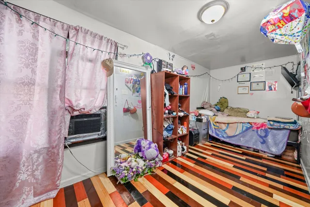 a bed room with a bed and a chandelier