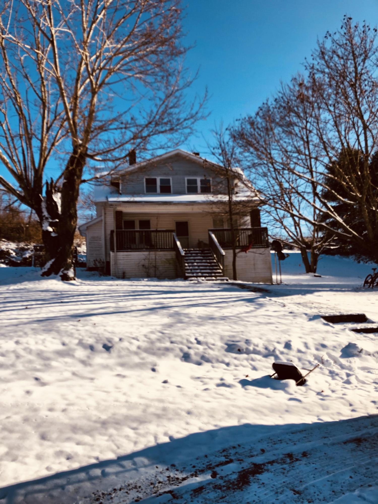 4076 Kirby Road Draper, VA 24324 - Photo 1 of 1 a view of a house with snow on the road