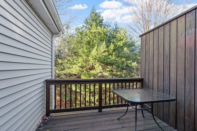 a view of a balcony with wooden floor