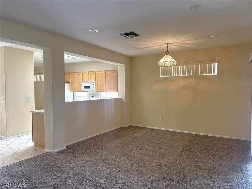 3034 Canal Walk Road Henderson, NV 89052 - Photo 17 of 24 This inviting space seamlessly connects to the kitchen, perfect for daily living and entertaining.