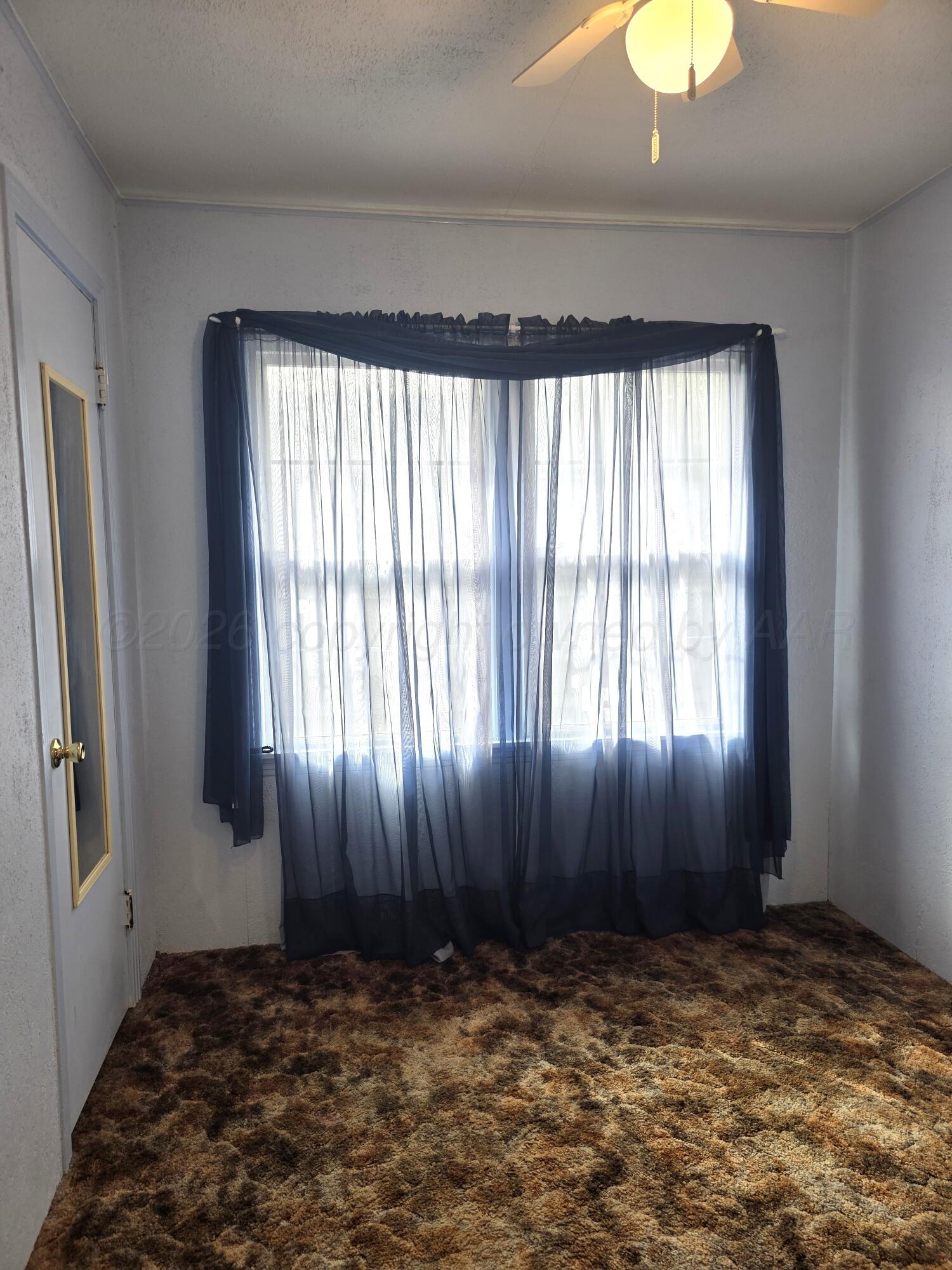 1812 Magnolia Street Amarillo, TX 79107 - Photo 12 of 27 a view of an empty room and window