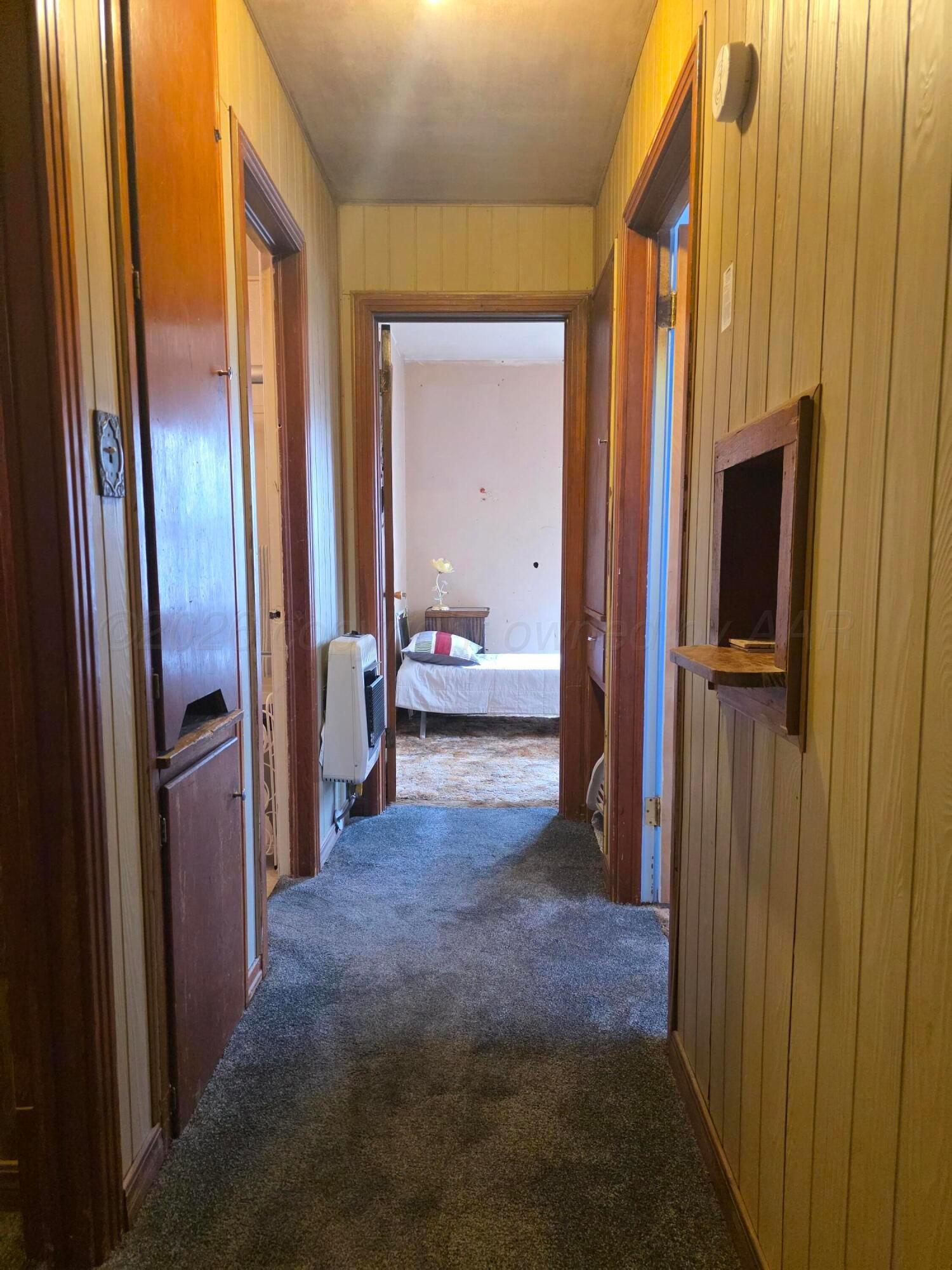 1812 Magnolia Street Amarillo, TX 79107 - Photo 18 of 27 a view of a hallway with living room and furniture