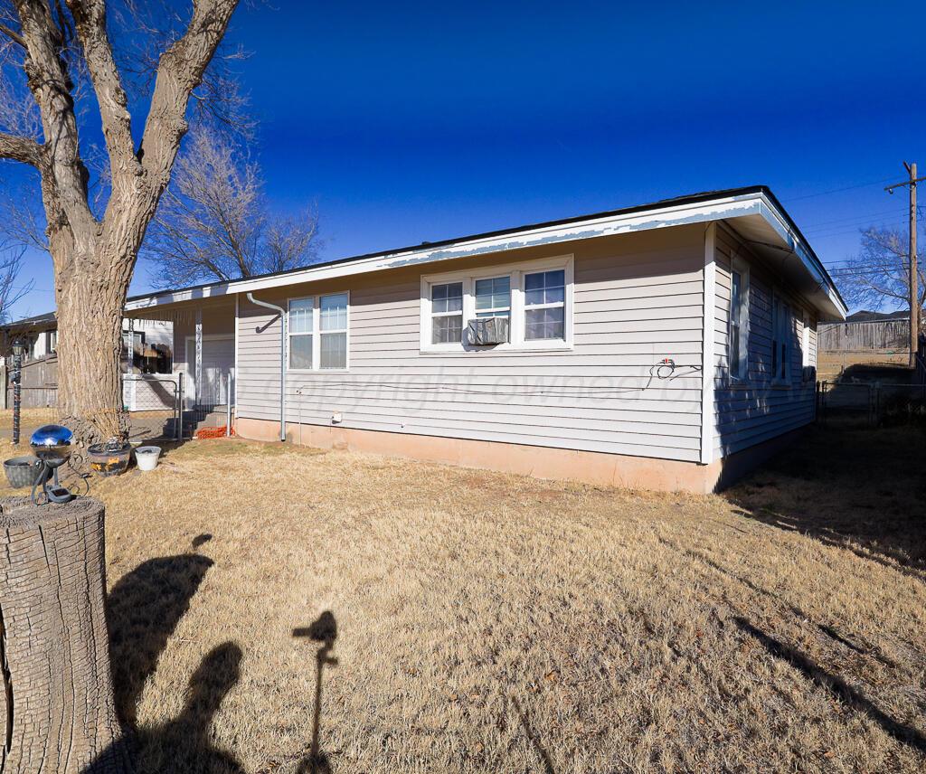 1812 Magnolia Street Amarillo, TX 79107 - Photo 26 of 27 a front view of a house with a yard