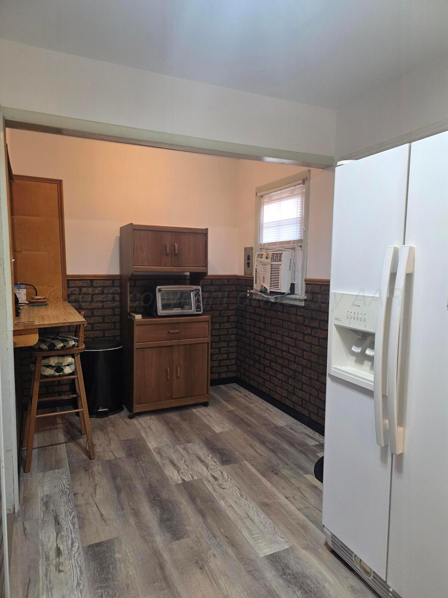 1812 Magnolia Street Amarillo, TX 79107 - Photo 9 of 27 a kitchen with a refrigerator and a stove