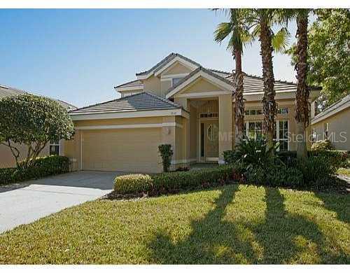 7280 Hawksnest Boulevard Orlando, FL 32835 - Photo 1 of 1 a front view of a house with a yard