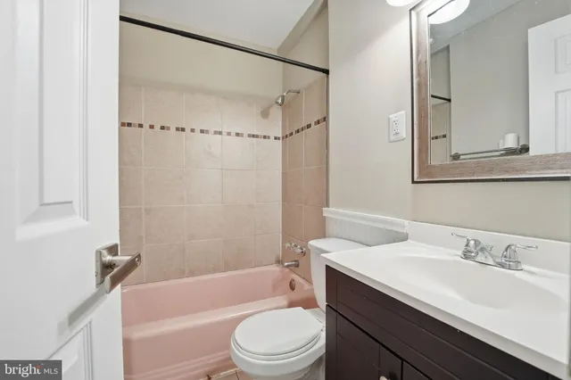 a bathroom with a sink a toilet and a bathtub