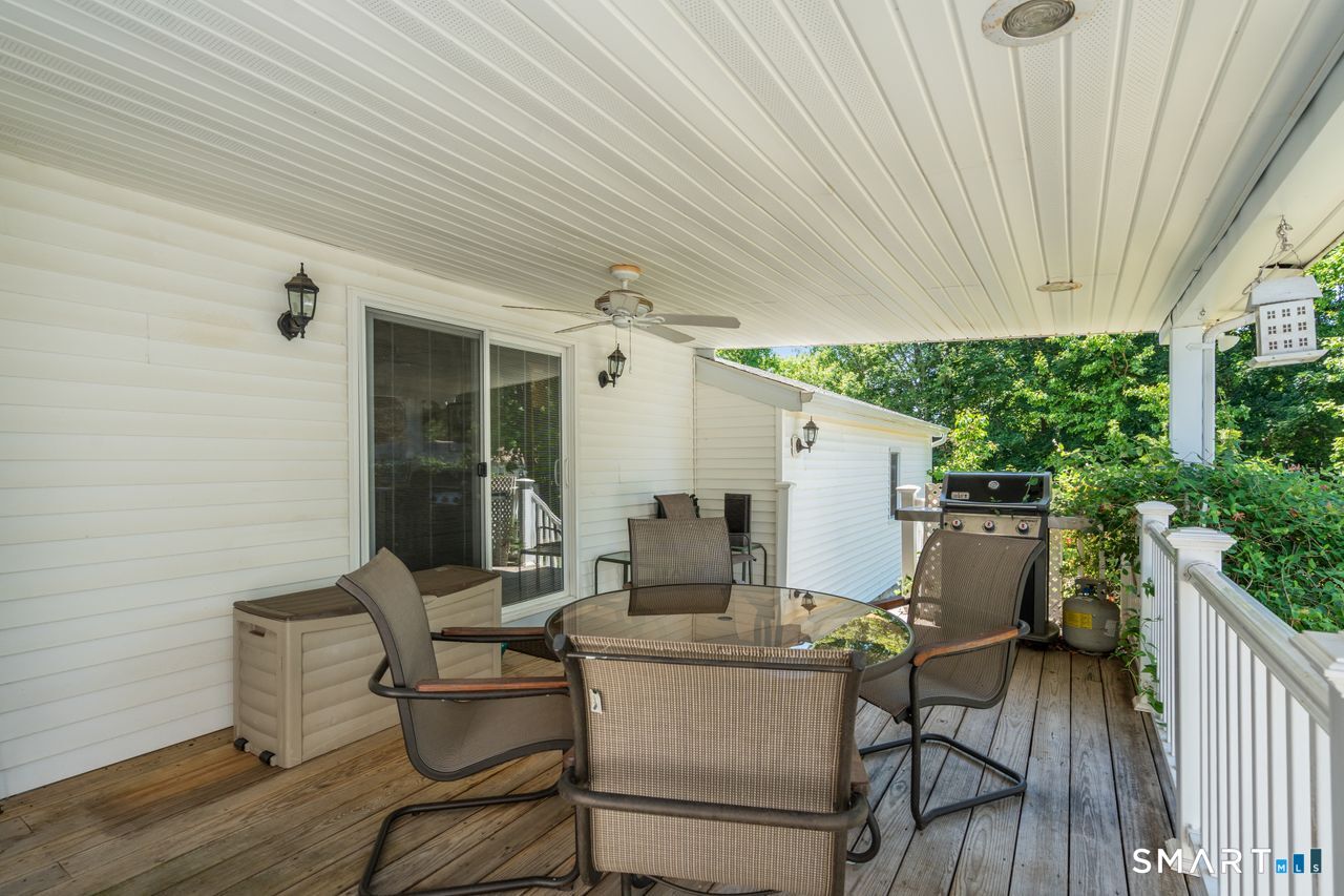 9 Stanton Road North Haven, CT 06473 - Photo 25 of 35 a patio with table and chairs and potted plants