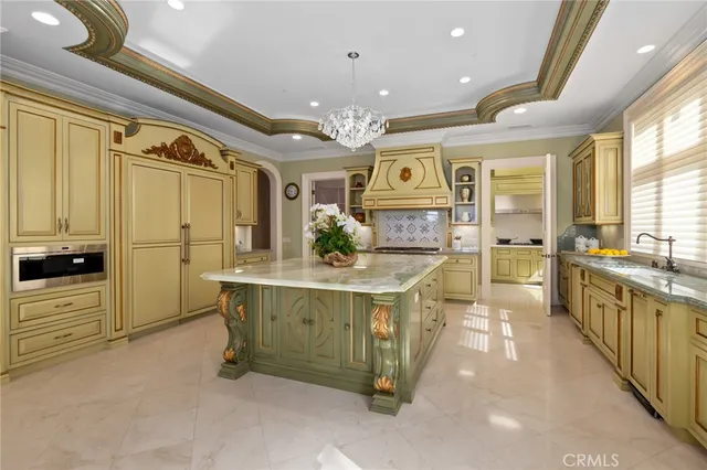 a living room with furniture large window and wooden floor