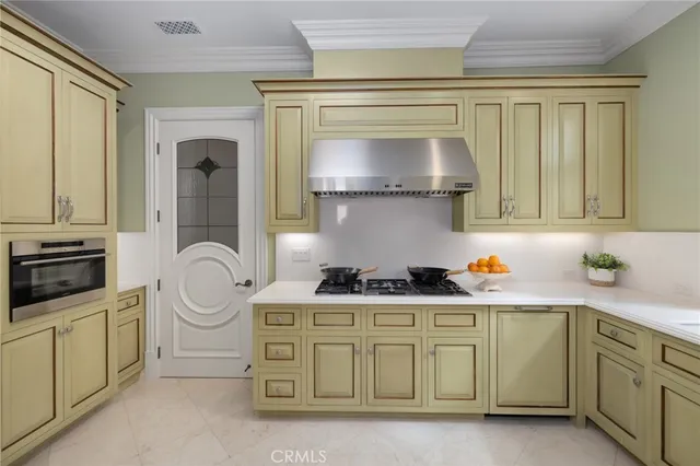 a view of a dining room with furniture a chandelier and wooden floor