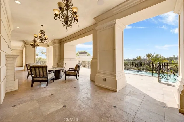 a view of a big building with a big yard and potted plants