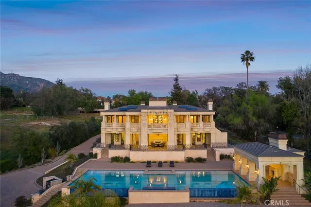a very nice looking room with wooden floor and furniture