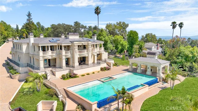 a view of an house with backyard porch and sitting area