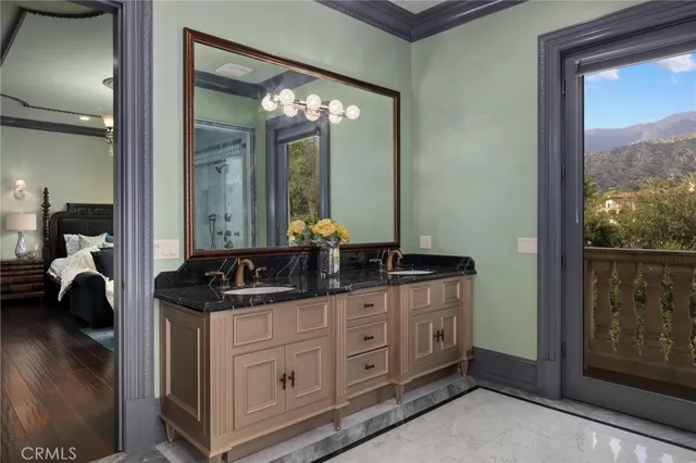 a view of a house with a yard and potted plants