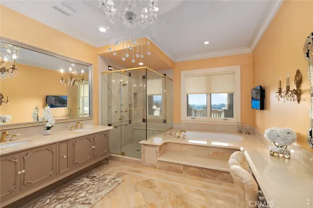 a dining room with furniture a chandelier and wooden floor