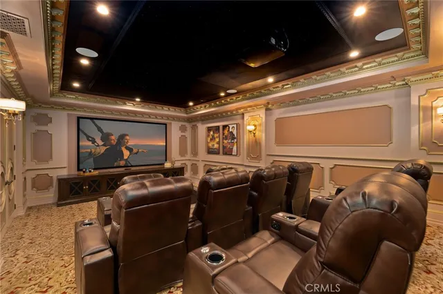 a front view of a building with a garden and plants