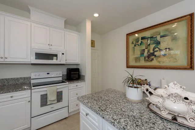 a kitchen with sink and cabinets
