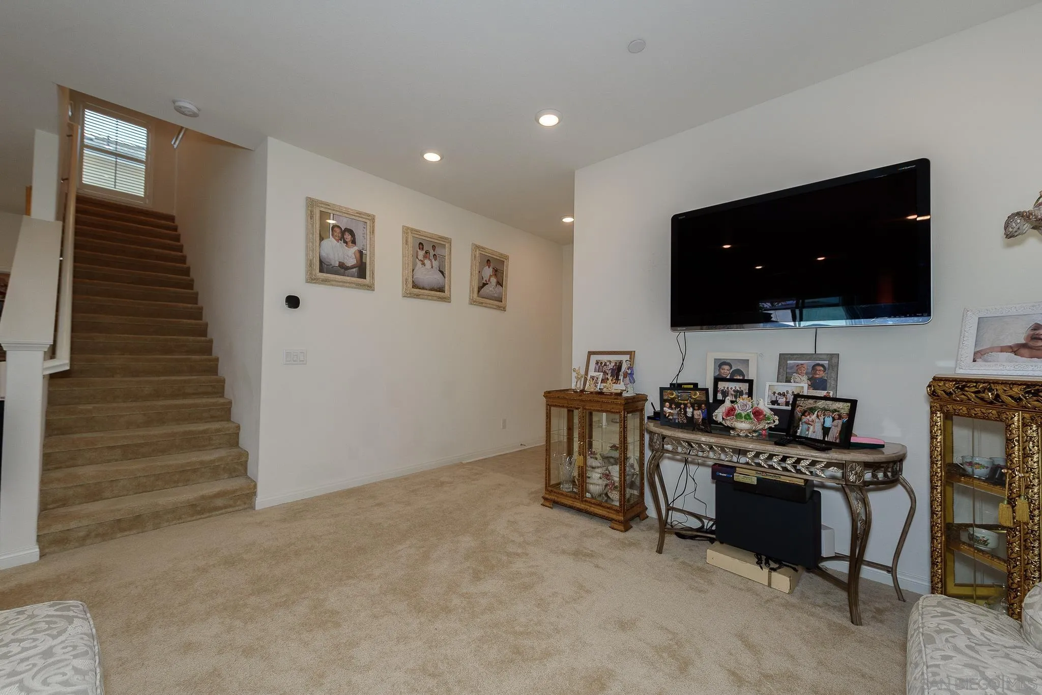 10761 Ensworth Way Spring Valley, CA 91978 - Photo 17 of 38 a view of a workspace with furniture and flat screen tv