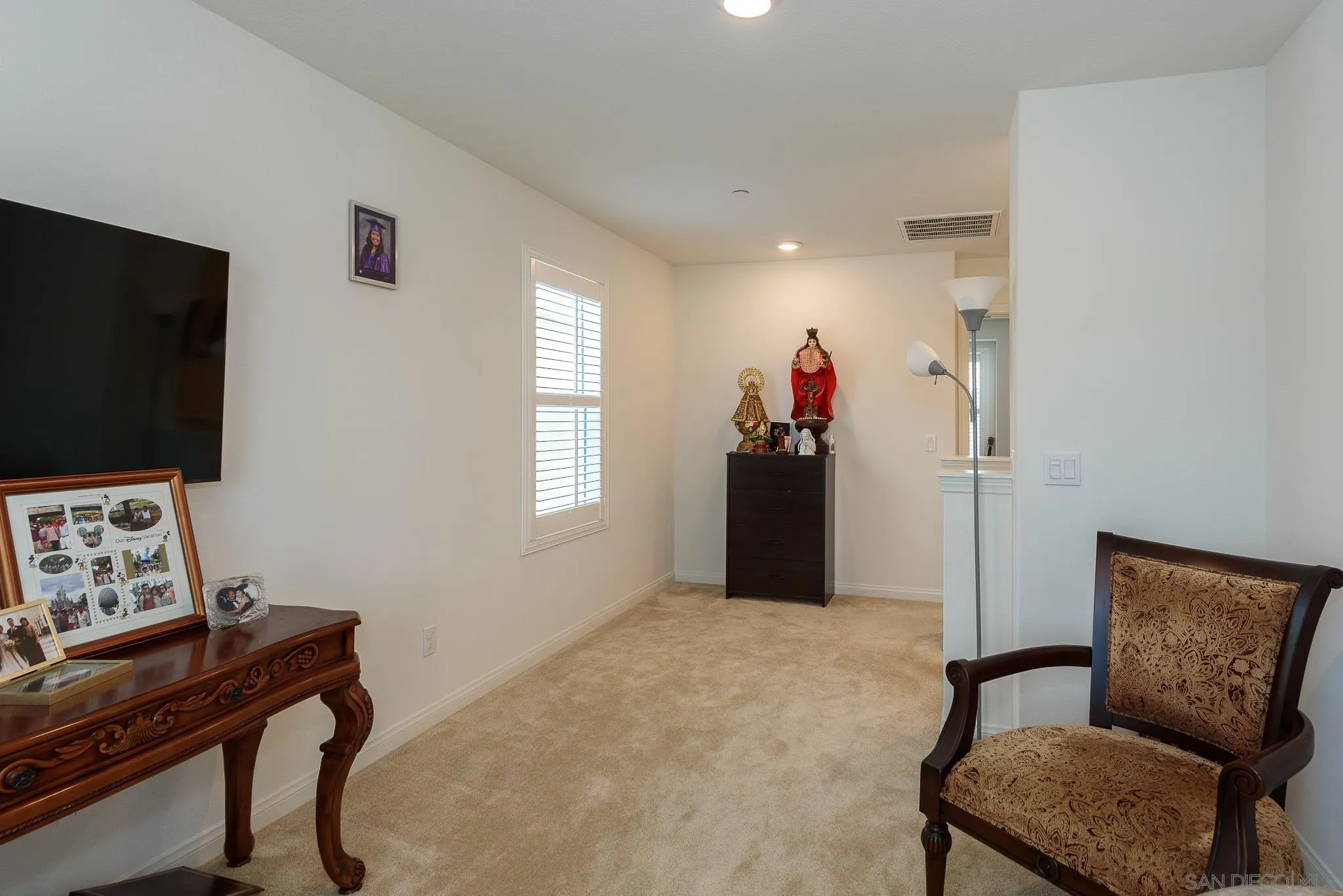 10761 Ensworth Way Spring Valley, CA 91978 - Photo 18 of 38 a living room with furniture and a flat screen tv