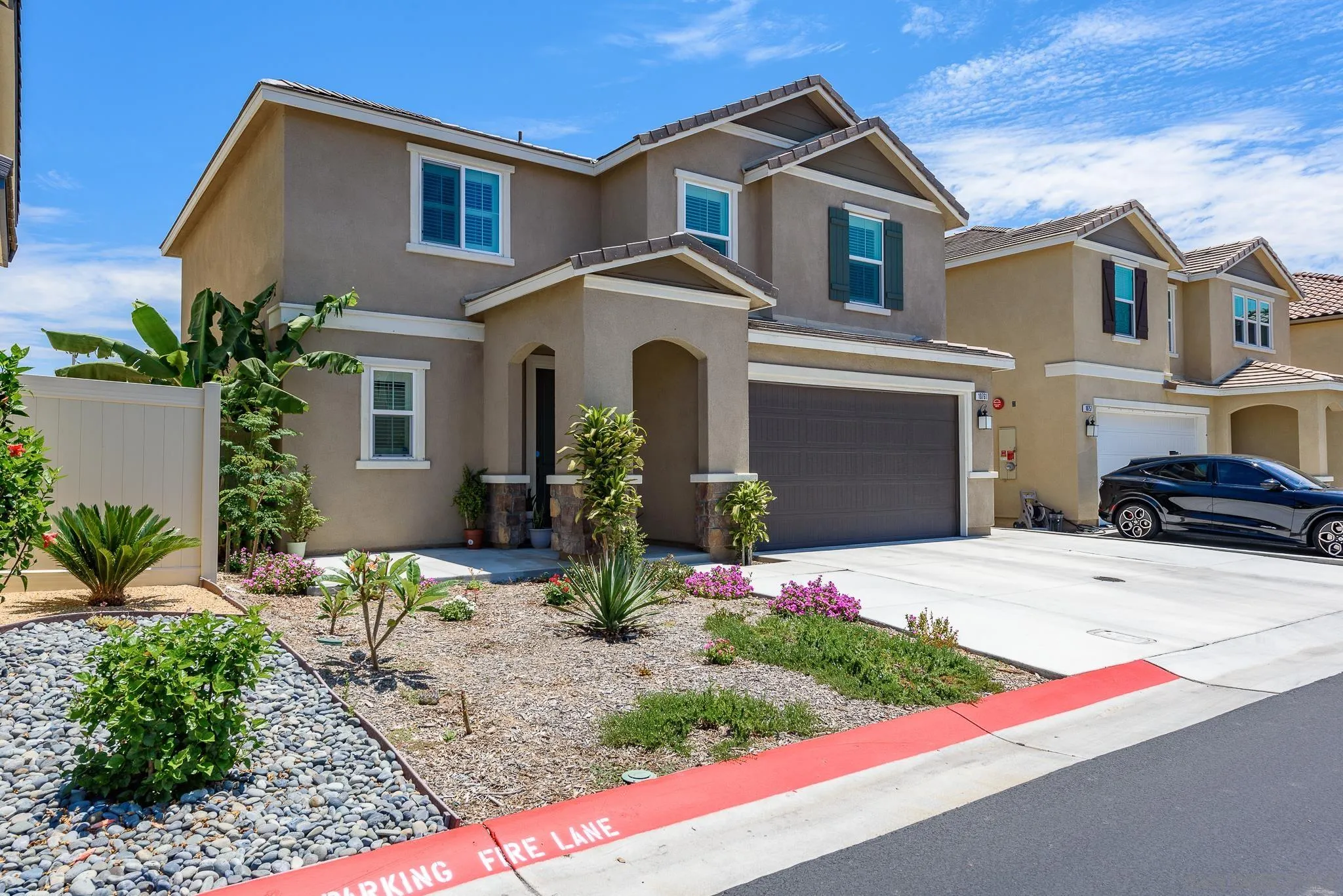 10761 Ensworth Way Spring Valley, CA 91978 - Photo 2 of 38 a front view of a house with a yard