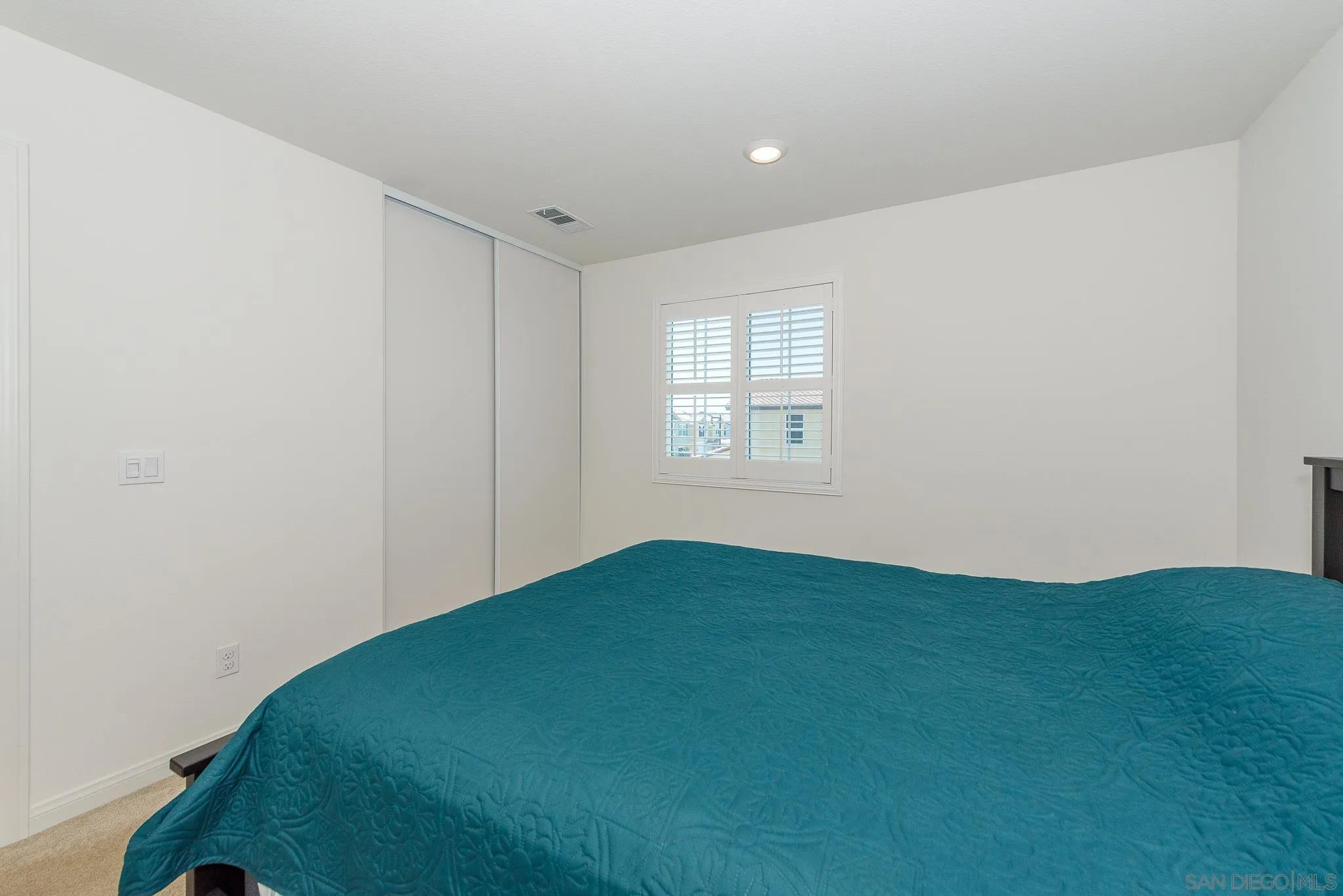 10761 Ensworth Way Spring Valley, CA 91978 - Photo 21 of 38 a view of an empty room with a window