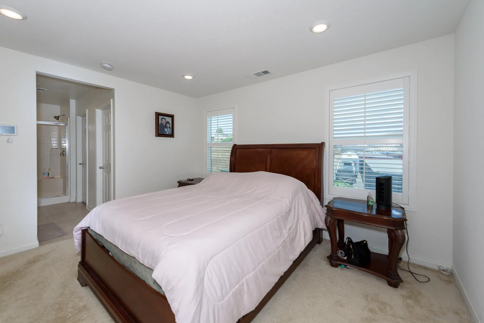 10761 Ensworth Way Spring Valley, CA 91978 - Photo 23 of 38 a bedroom with a bed and a window
