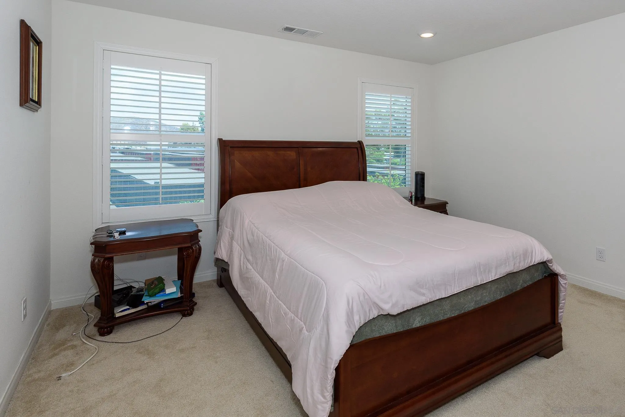10761 Ensworth Way Spring Valley, CA 91978 - Photo 25 of 38 a bedroom with a bed and a dresser