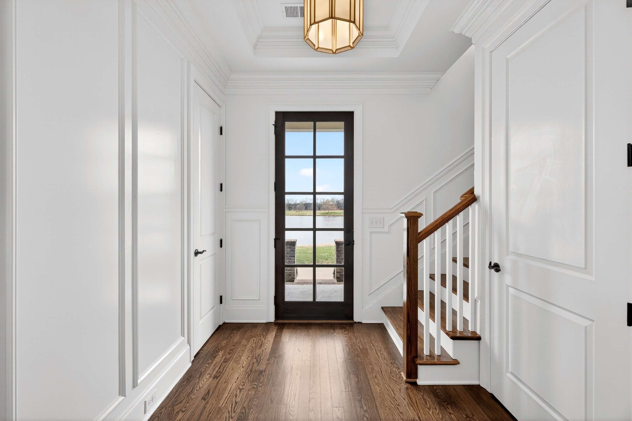165 Front Street Franklin, TN 37064 - Photo 11 of 63 a view of a hallway with wooden floor and stairs