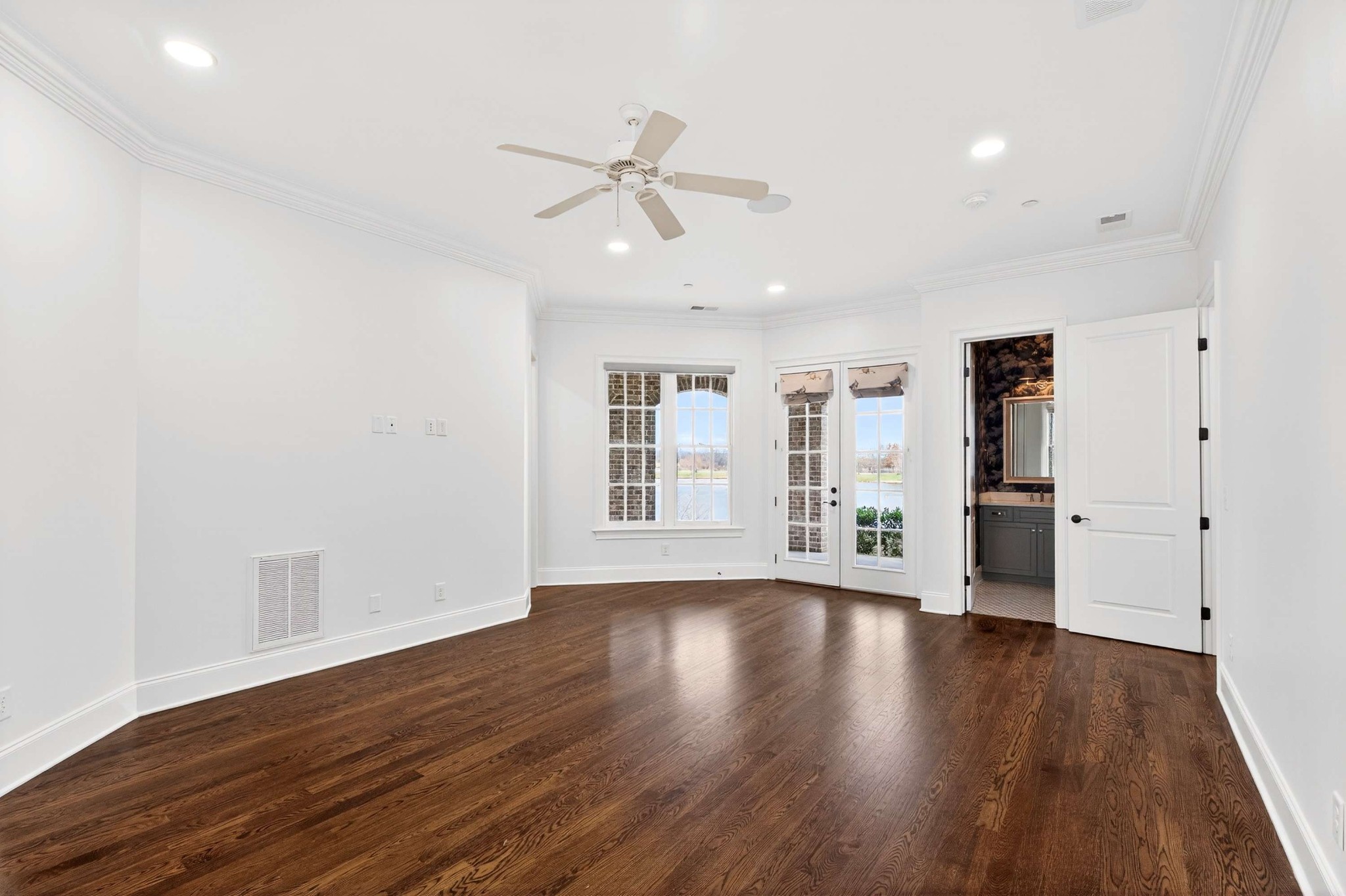 165 Front Street Franklin, TN 37064 - Photo 14 of 63 a view of an empty room with wooden floor and a window