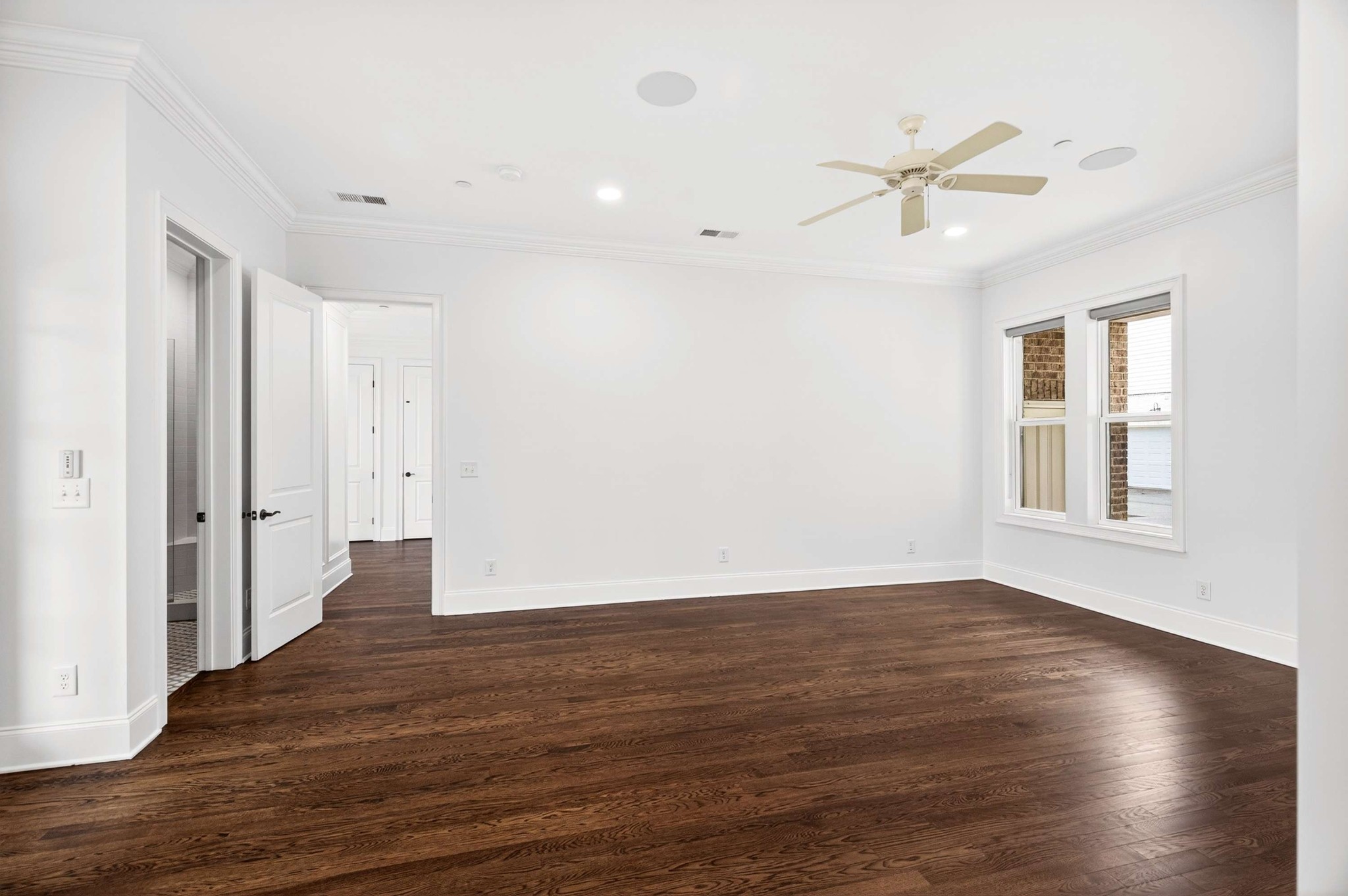 165 Front Street Franklin, TN 37064 - Photo 15 of 63 a view of an empty room with wooden floor and a window