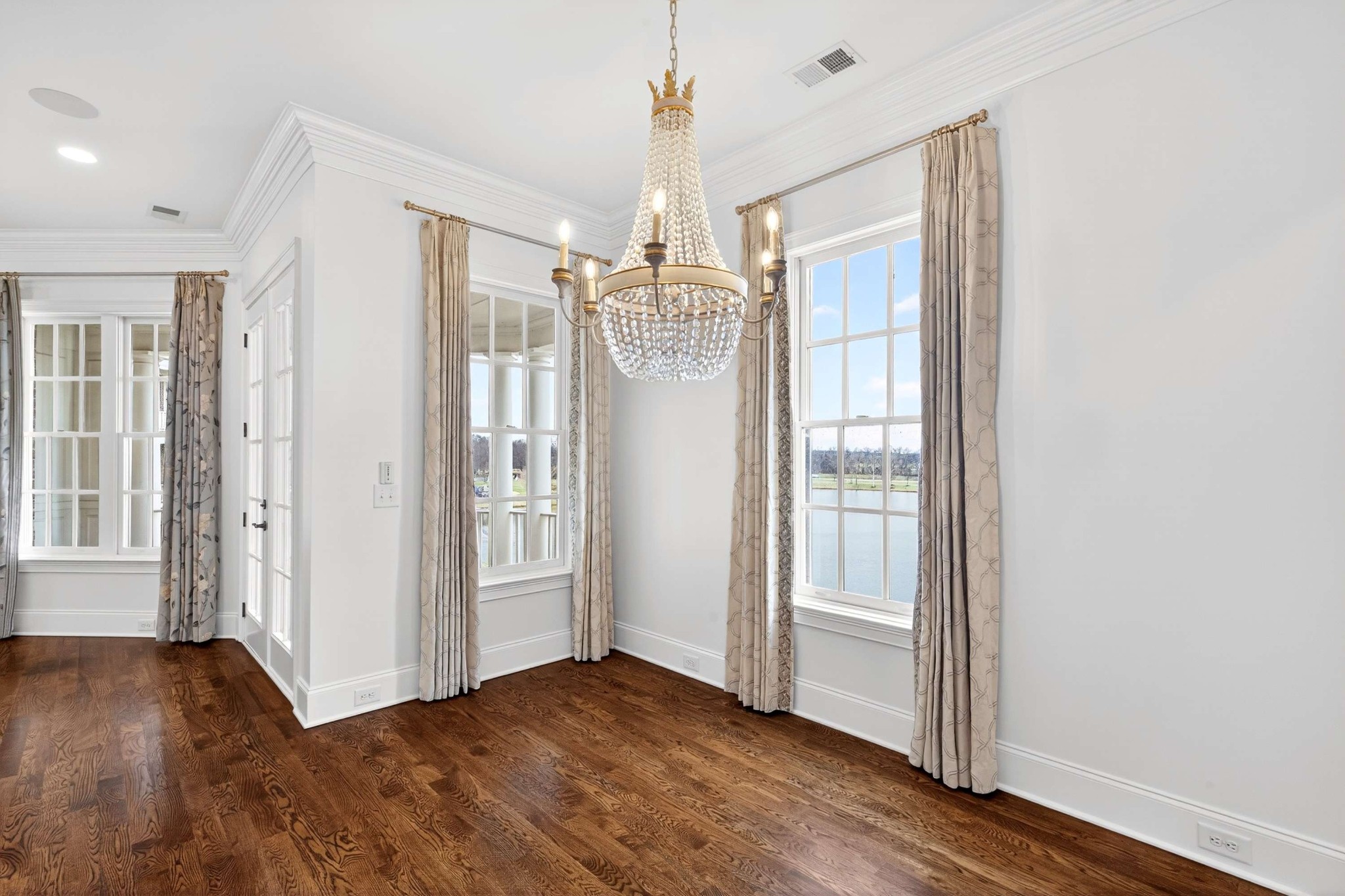165 Front Street Franklin, TN 37064 - Photo 20 of 63 a view of a room with wooden floor front door and windows