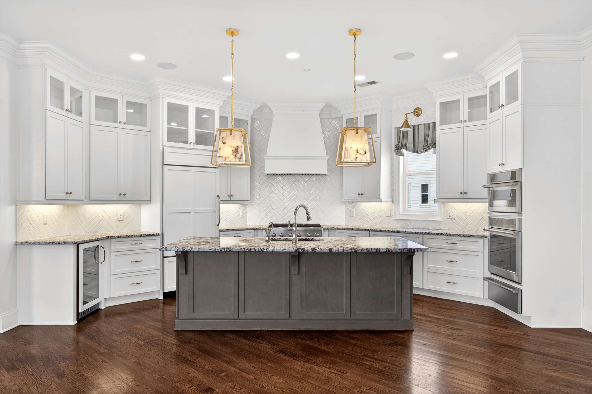 165 Front Street Franklin, TN 37064 - Photo 24 of 63 a kitchen with granite countertop a sink cabinets and wooden floor