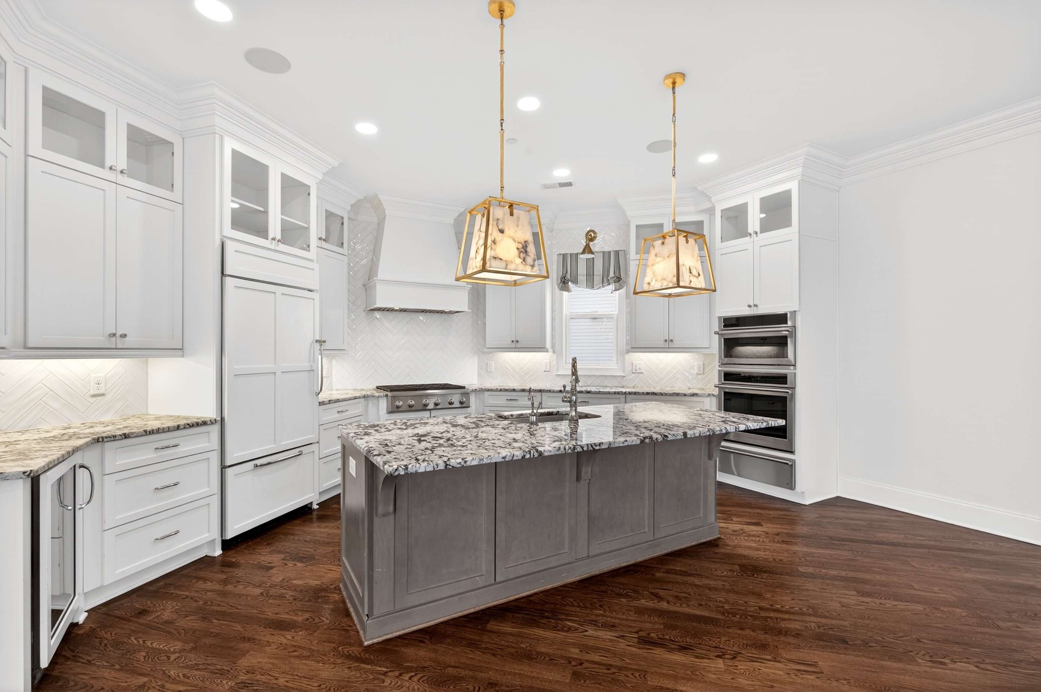165 Front Street Franklin, TN 37064 - Photo 27 of 63 a kitchen with stainless steel appliances granite countertop a lot of counter space and wooden floors
