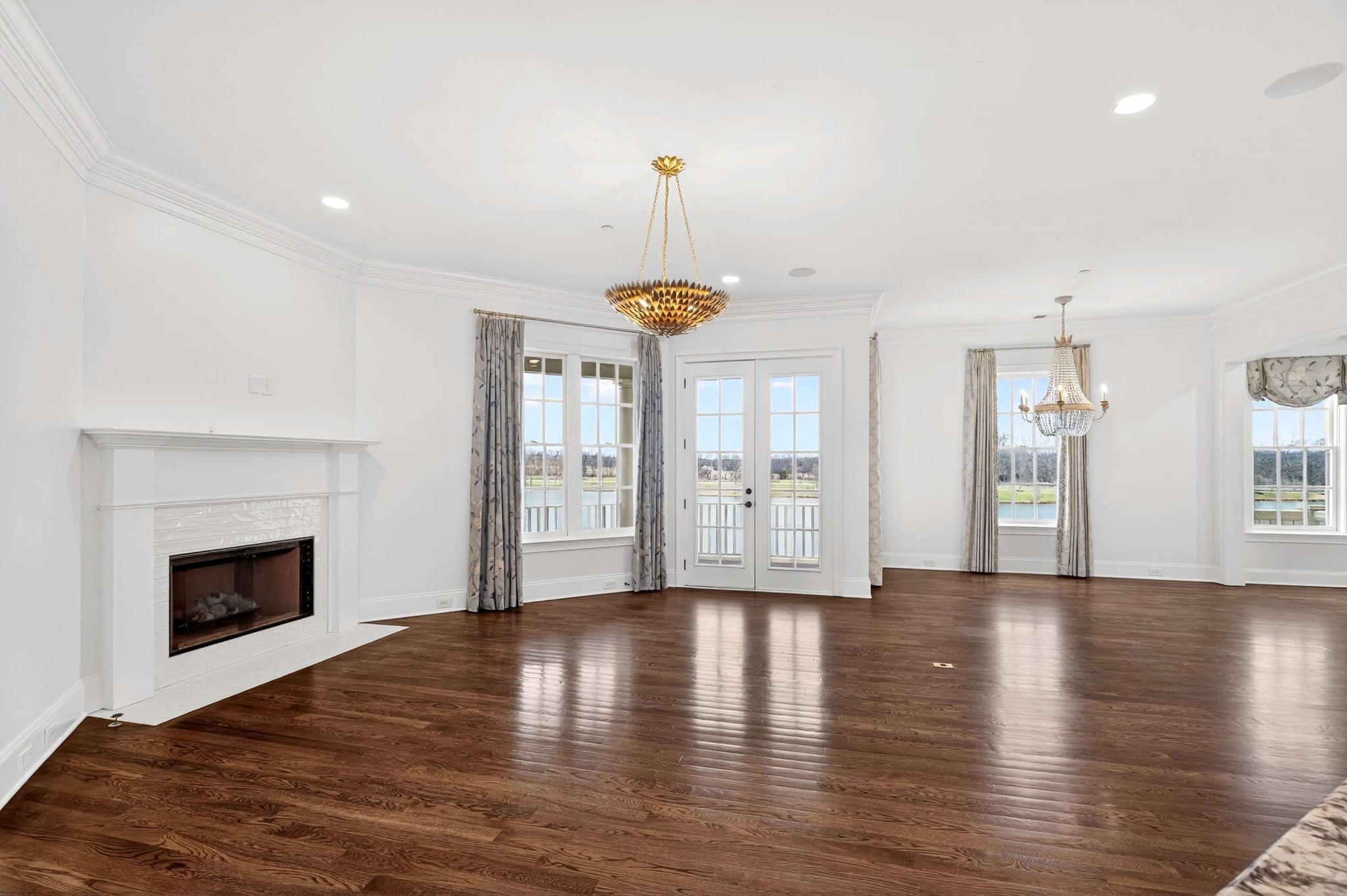 165 Front Street Franklin, TN 37064 - Photo 36 of 63 a view of an empty room with wooden floor and a window
