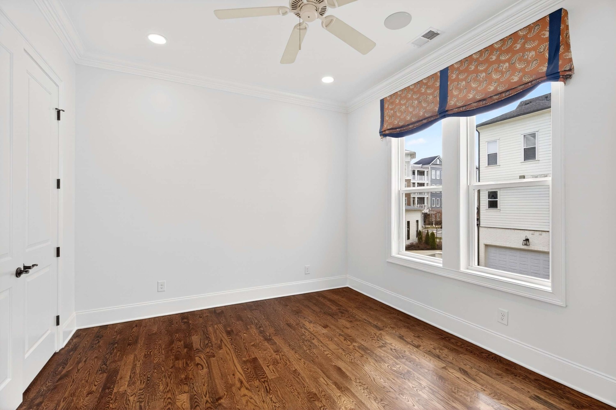 165 Front Street Franklin, TN 37064 - Photo 40 of 63 a view of empty room with wooden floor and fan