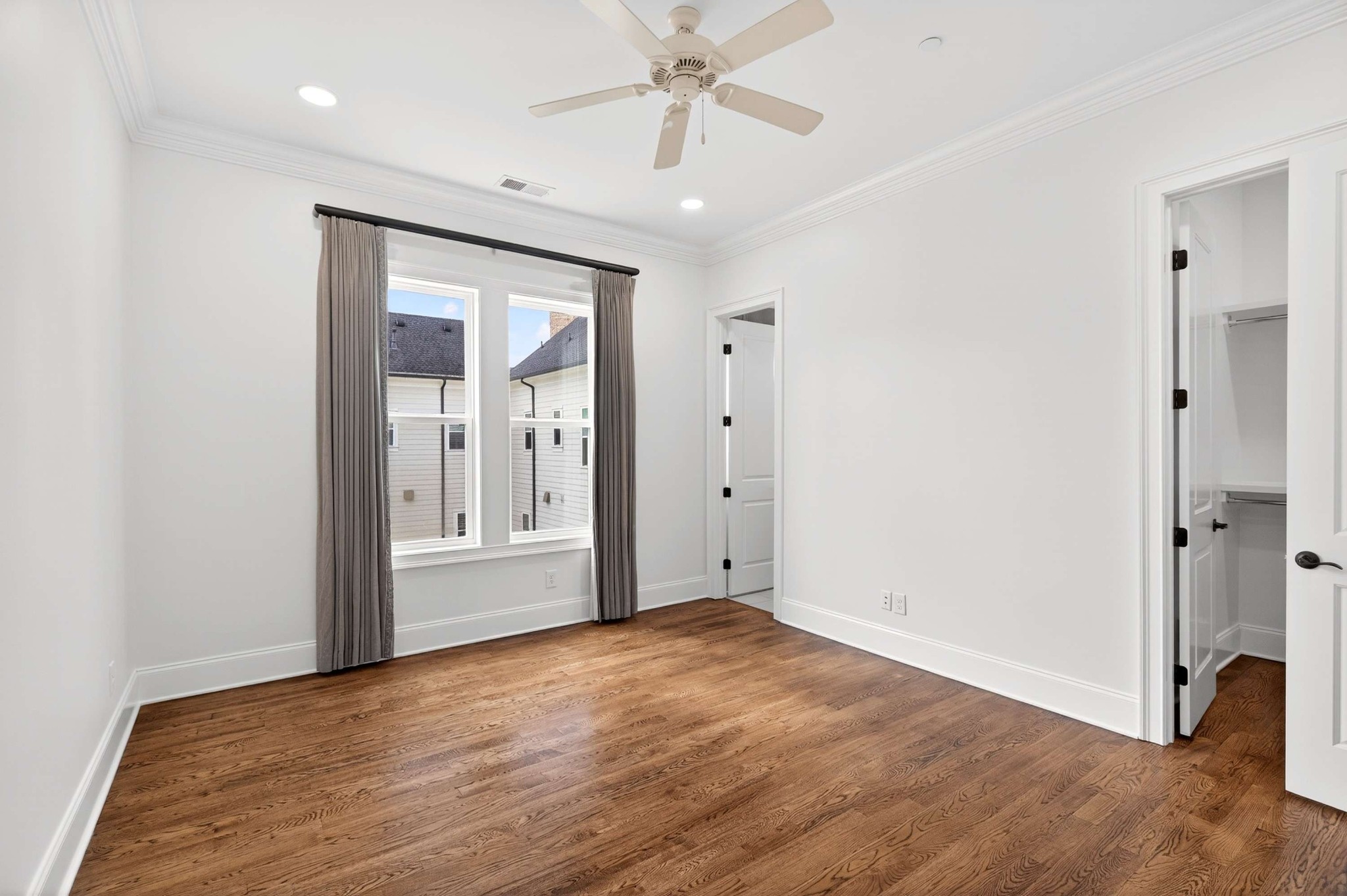 165 Front Street Franklin, TN 37064 - Photo 44 of 63 wooden floor in an empty room with a window